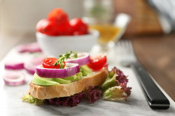 Delicious sandwich on marble board, closeup