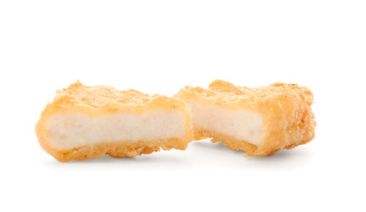 Tasty chicken nuggets on white background