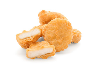Tasty chicken nuggets on white background