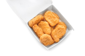 Box with tasty chicken nuggets on white background