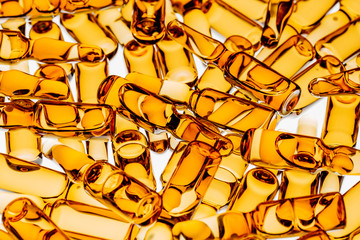 production of medicines. lot of ampoules on light background.