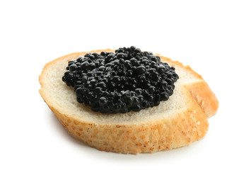 Bread with black caviar on white background