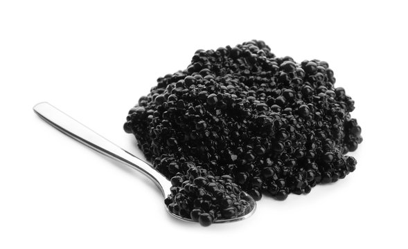 Delicious black caviar and spoon on white background