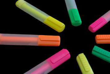 Multicolored highlighters isolated on black background, Highlighter to highlight text, study tools