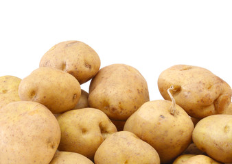bunch of freshly harvested potatoes on white