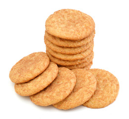 Stack of snickerdoodles over white.