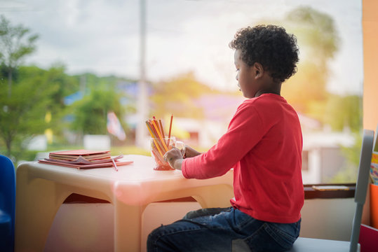 Preschool Kid In Class Of Drawig Subject At School In The Classroom