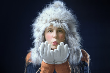Teenage girl with a fur cap