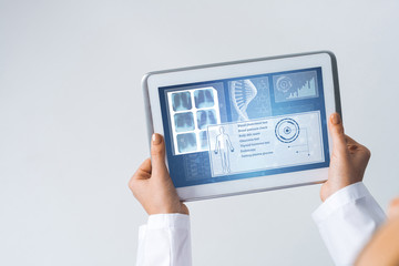 Close of female doctor hands working with tablet pc computer