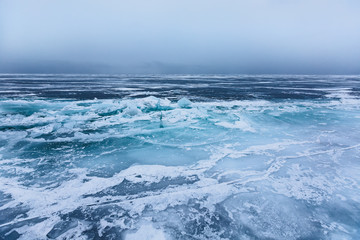 Beautiful ice with cracks on the Lake Baikal.