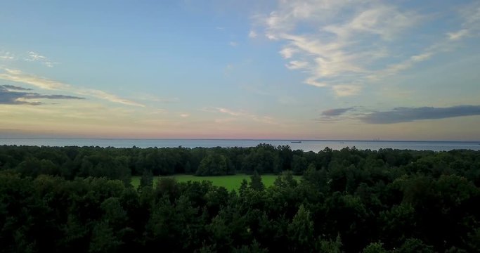 Panoramic view from the drone of the coast of the Gulf of Finland during a sunset near the park Alexandria, St. Petersburg, Russia
