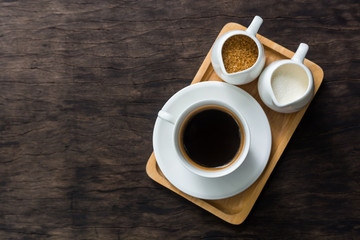 Hot cup of black coffee  on table