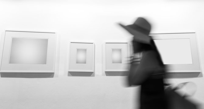 woman walking in the empty gallery