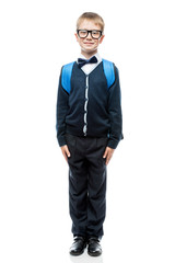 Obraz na płótnie Canvas portrait of an intelligent schoolboy in school uniform, glasses and with a backpack in full length on a white background