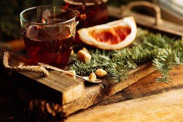 hot pink tea with cinnamon in a transparent mug, rustic style