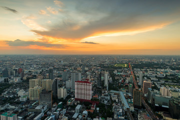 orange sunset sky over a large metropolis in Asia, Bangkok, Thailand