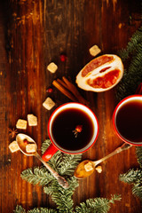 Obraz na płótnie Canvas Christmas hot cranberry tea, cookies and light bokeh, closeup
