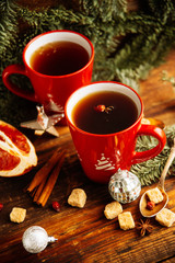 Christmas hot cranberry tea, cookies and light bokeh, closeup