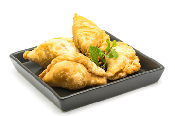 Curry Puffs in a black plate