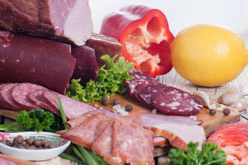 Meat products. Smoked ham, sausage, bacon, vegetables