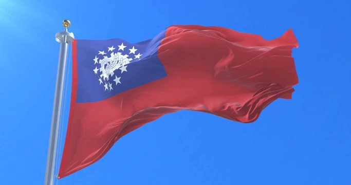 Flag of Myanmar or Union of Burma waving at wind in slow in blue sky, loop