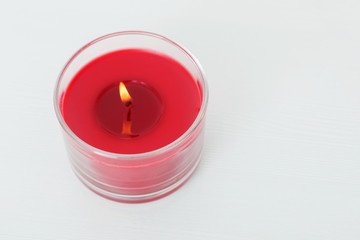 red candle on white background