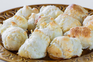 Puff pastry wrapped around a sausage (wurstel) and baked in the oven. Crispy homemade stuffed panzerotti with wurstel and cheese (ingredients: puff pastry, sausage - frankfurters, cheese)