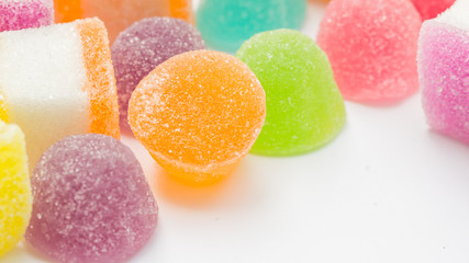 Colorful gummy candy on a white background.