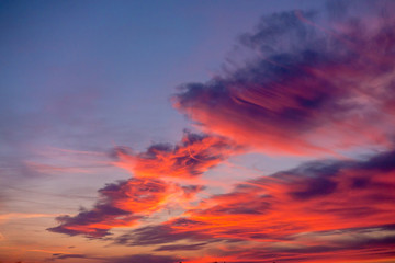 Naklejka na ściany i meble Pink clouds at the sunset