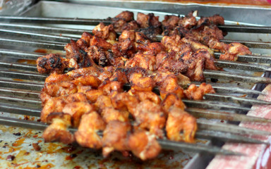 making or frying Indian street food chicken kababs