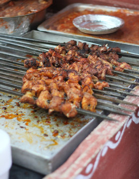 making or frying Indian street food chicken kababs