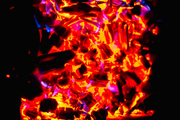Wooden coils and fire in the grill.
