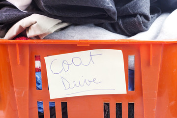 clothes in orange box for donation