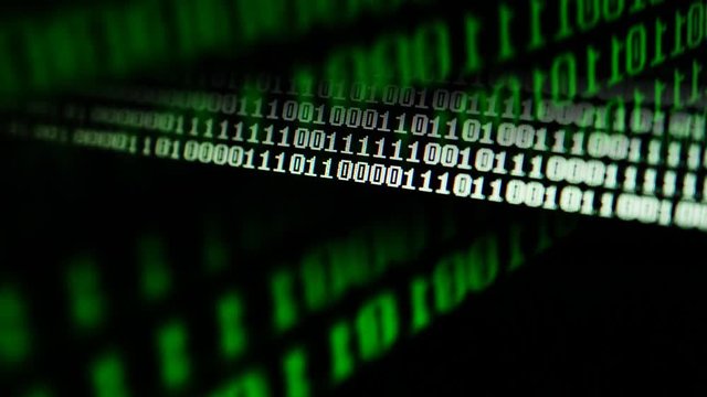 	Binary code on the monitor screen.	Shooting of a binary code, background.