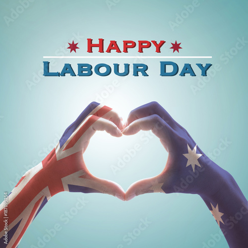 Happy labour day with Australia flag pattern on people hands in heart shape