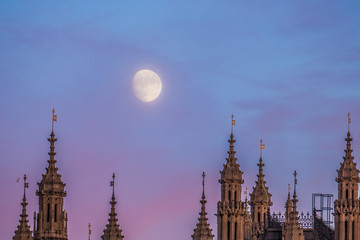 Fototapeta na wymiar Moon Over Houses Of Parliament And Westminster Palace In Uk, London.