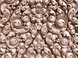 Asian religious patten decoration on clay wall in Thai buddha temple 
