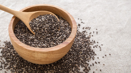 Chia seeds in wooden bowl