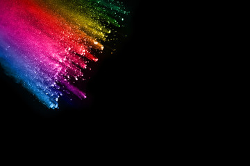 abstract colored dust explosion on a black background.abstract powder splatted background,Freeze...