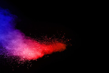 abstract colored dust explosion on a black background.abstract powder splatted background,Freeze...