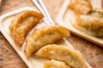 Gyoza dumplings in wooden plate