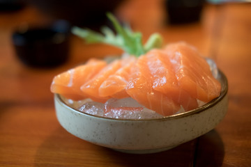 Raw salmon slice or salmon sashimi