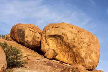  Devils Marbles are huge granite boulders scattered across a wide, shallow valley, 100 kilometers south of Tennant Creek in the Northern Territory. Australia. Outback.