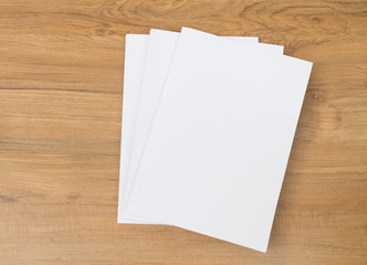 Blank catalog, magazines, book mock up on wooden  background
