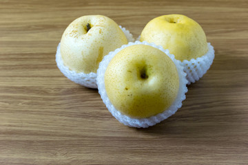 Chinese pear fruit and healthy on the wooden floor.