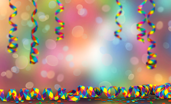 abtrakter party hintergrund, bunte papierschlangen h&auml;ngend und auf dem Tisch liegend als Karnevalsdekoration