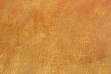 Scratched vintage or grunge orange background of natural cement or plaster. Old texture as a retro pattern wall