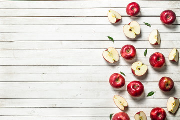 Naklejka na ściany i meble Fresh red apples with leaves.