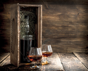 bottle of cognac in an old box.