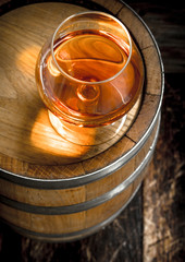 barrel with a glass of cognac.